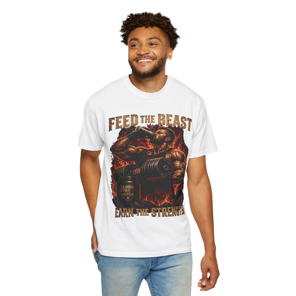 Feed the Beast garment-dyed tee, lifter mid-curl with protein shake framed in fire